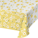 Rectangular Sweet Daisy paper tablecover measuring 54 x 96 inches, featuring a yellow base with scattered white daisy flowers and green leaf accents for a floral party table setup.
