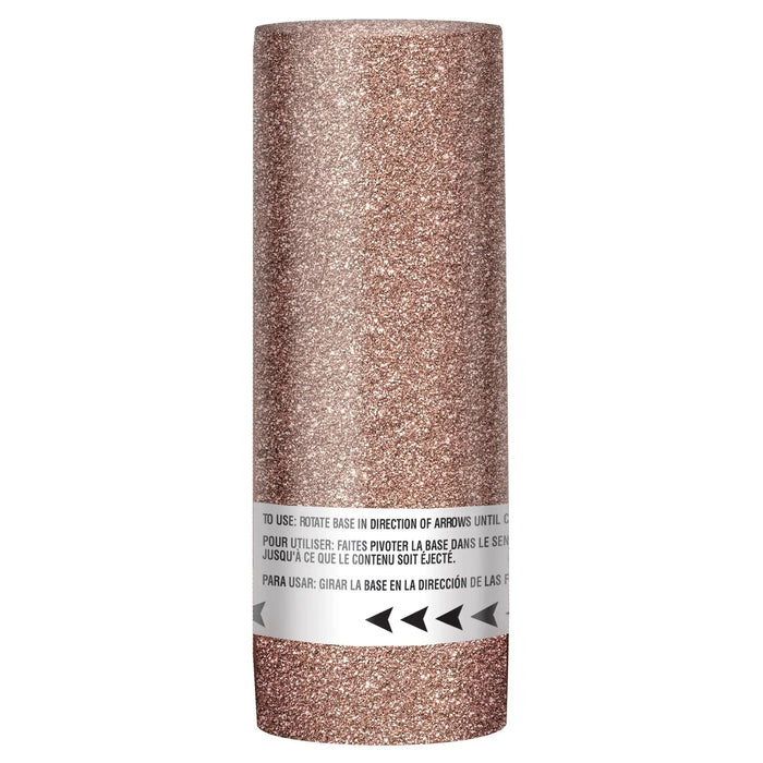 Cylindrical rose gold glitter confetti popper with white instruction band featuring multilingual directions and directional arrows around the middle.