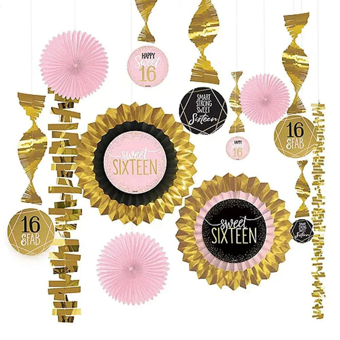 Sweet Sixteen party decoration kit featuring pink paper fans, gold foil accents, hanging spirals, and rosette medallions with pink and black "Sweet Sixteen" centerpieces.