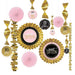 Sweet Sixteen party decoration kit featuring pink paper fans, gold foil accents, hanging spirals, and rosette medallions with pink and black "Sweet Sixteen" centerpieces.