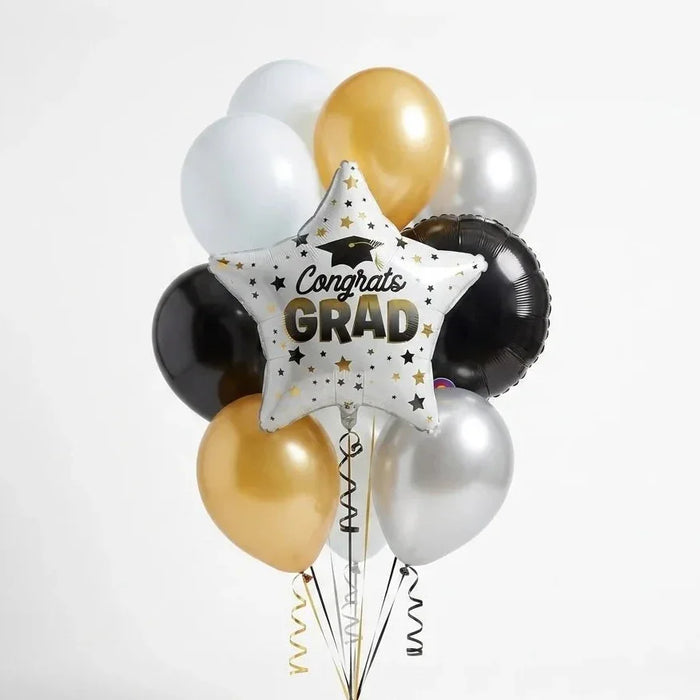 Graduation-themed balloon bouquet with 'Congrats Grad' star balloon on a white background