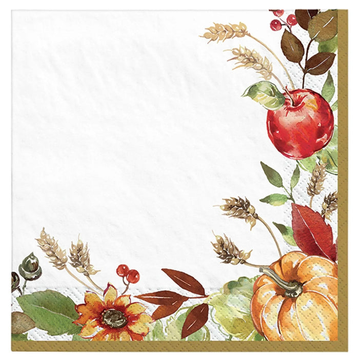 White beverage napkins with autumnal botanical illustrations including a red apple, orange pumpkin, wheat stalks, red berries, leaves, and a flower arranged around the borders with a gold trim.