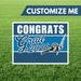 Graduation-themed customizable sign with 'Congrats Grad 2026' on a grass background