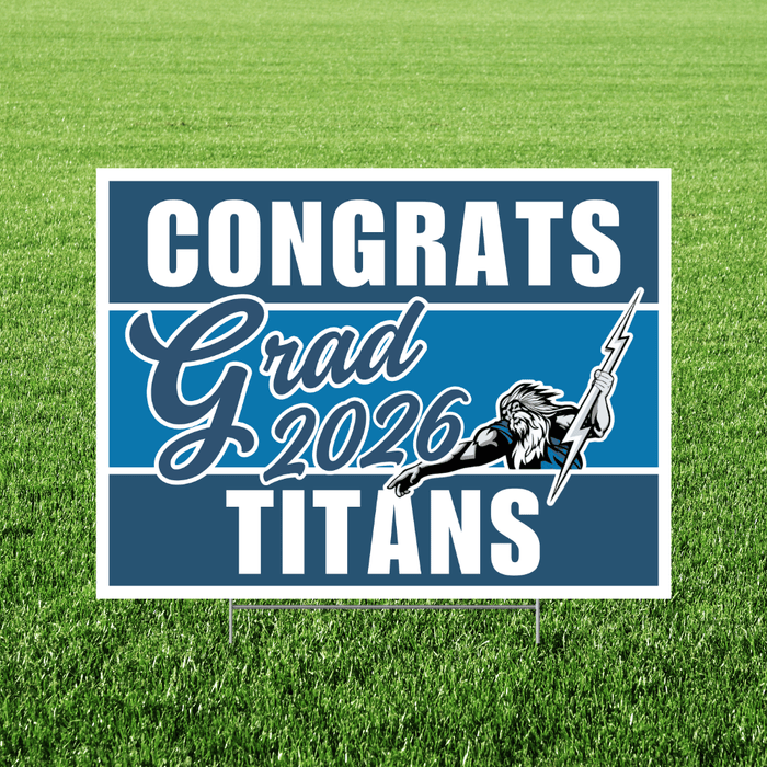 Blue and white yard sign with "CONGRATS Grad 2026 TITANS" text and an illustration of a Native American mascot holding a spear, mounted on green grass.