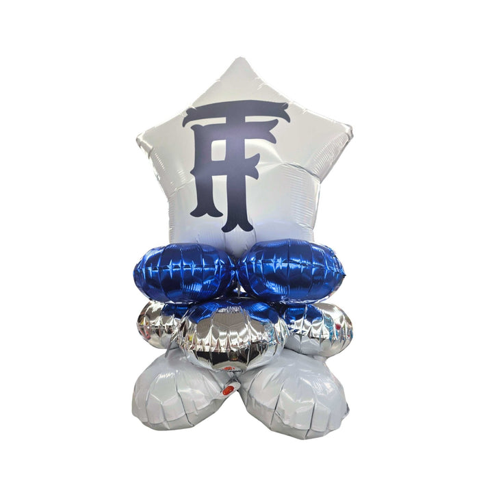 Balloon arrangement with blue and silver balloons on a white background