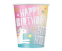 Pink and pastel gradient paper cup with silver "Happy Birthday" text, unicorn and rainbow graphics, and gold star accents.