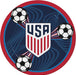 Round paper plate with USA shield logo featuring red and white vertical stripes, navy blue background with soccer ball graphics, and red outer border.