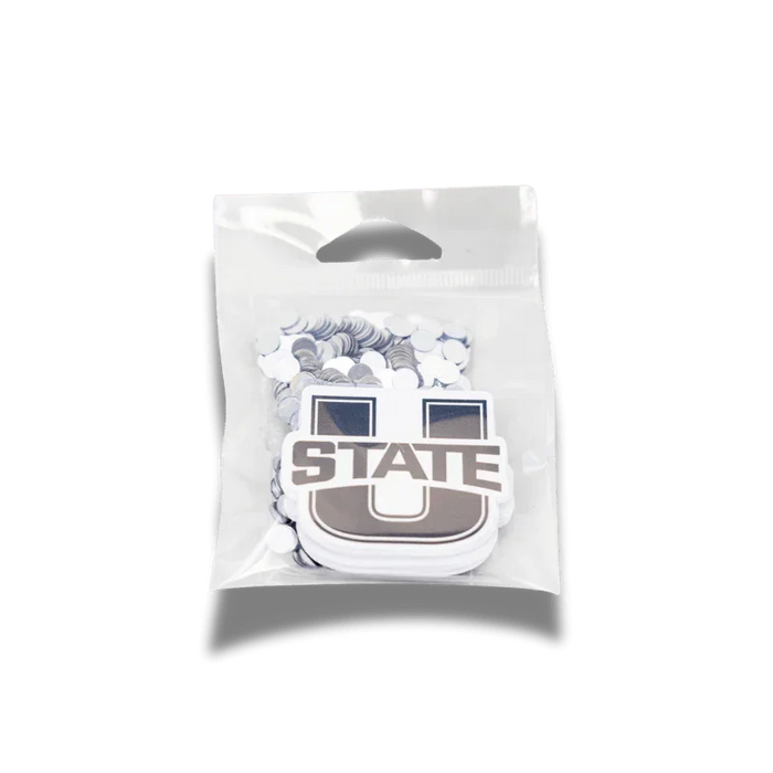 Clear plastic package containing 24 white decorative cutouts featuring the Utah State University "U" logo in brown and navy blue with feather design elements.