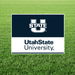 Utah State University sign on a grass background