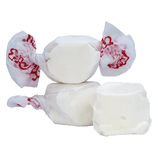 Three white vanilla salt water taffy candies with red printed wrappers, plus two unwrapped pieces showing the pale cream-colored candy interior.