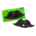 Black licorice mustache-shaped candy displayed in front of its bright green packaging labeled Wack-o-Wax Mr. Stache.