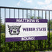 Banner with 'Matthew is Weber State Bound!' text and school logo on a fence.
