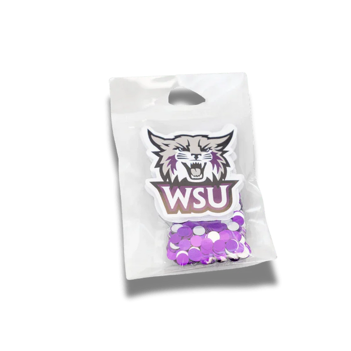 Clear cellophane bag containing a WSU Wildcat logo sticker and purple and white circular confetti pieces.