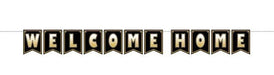 Black and gold decorative banner with "WELCOME HOME" in large gold letters across individual pennant-shaped flags.