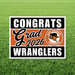 Graduation-themed sign for West Mesquite Wranglers with 'Congrats Grad 2026' on a grass background