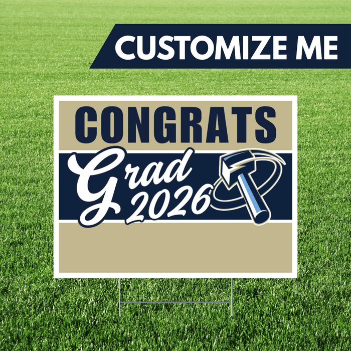 Graduation-themed sign with 'Congrats Grad 2026' on a grass background