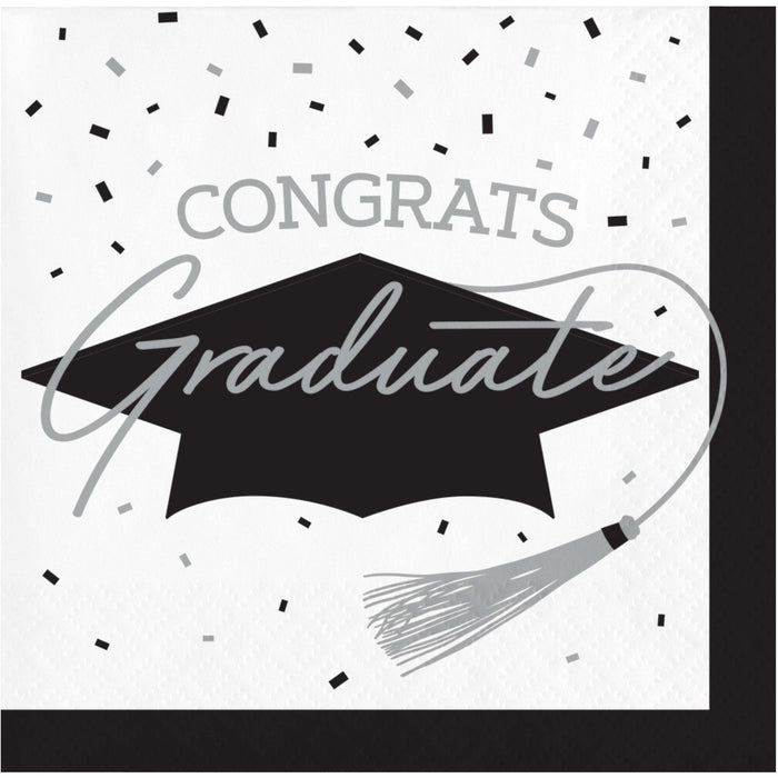 White beverage napkin featuring a black graduation cap with tassel and gray "Congrats Graduate" text surrounded by confetti design elements.
