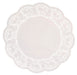 White lace doilies with an intricate openwork floral pattern and scalloped edges arranged in a circular shape.