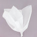 White crinkled tissue paper sheets loosely arranged in a bunch against a gray background.