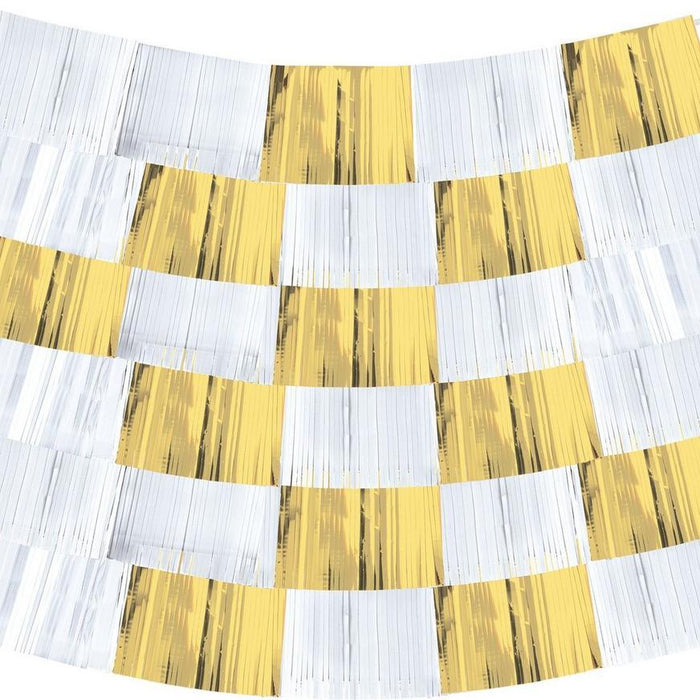 White and gold metallic fringe backdrop with alternating vertical strips of white and shimmering gold, arranged in curved horizontal rows for a draped effect.