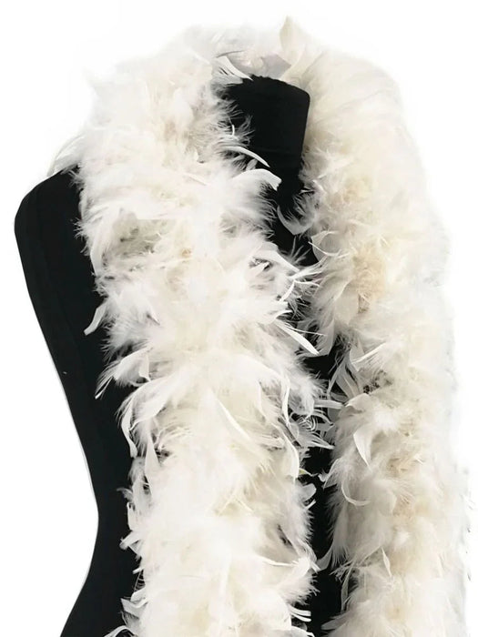 White fluffy feather boa draped over a black form, displaying the lightweight plumage and full volume of the garment accessory.
