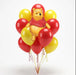 Winnie the Pooh character balloon centerpiece surrounded by red and yellow balloons with curled ribbons on a white background.