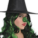Green latex witch nose with black elastic band attached, displayed on a model wearing a black wide-brimmed hat.
