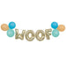 Gold foil letter balloons spelling "WOOF" with turquoise, teal, and tan latex balloons arranged on either side in a decorative banner garland.