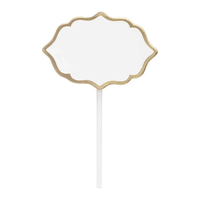 Gold scalloped-edge decorative food pick with a white stem and blank center for writing.