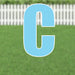 Large light blue yard sign letter C with white border and metal stakes, displayed on green grass with white picket fence background.
