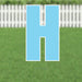 Light blue yard card shaped like the letter H with white border and metal stakes, displayed on grass with white fence in background.