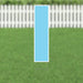 Light blue letter I yard sign with white border and metal ground stakes, displayed on grass in front of a white picket fence.