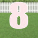 Pink number 8 yard sign with white border and metal stakes, displayed in a green lawn with white picket fence background.