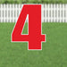 Red number 4 yard sign with white outline and supporting stakes, displayed on green grass with a white picket fence in the background.