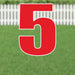 Large red number 5 yard sign with white outline and metal stakes, displayed on grass with white picket fence background.